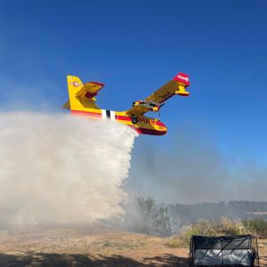 On Friday, a helicopter delivering water to the 150-acre Barth Fire in Caldwell County almost collided with a drone that came within feet of the aircraft.